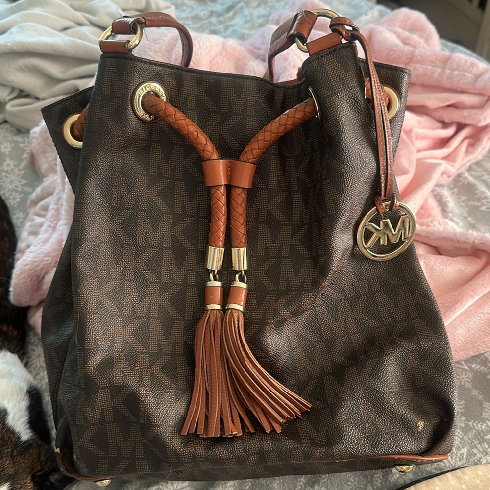 Nice MK bag 2 small little spots on the outside of bag but nice bag !